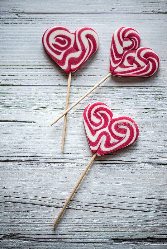 Heart Shape Lollipops on White Wooden Background, Valentine´s Day Concept